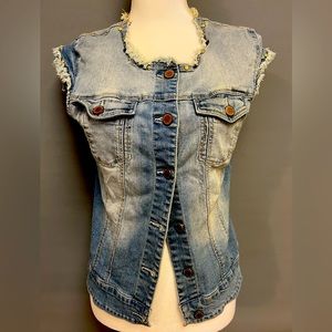 Romeo & Juliet Couture denim vest. She has stretch & hugs all the right curves!